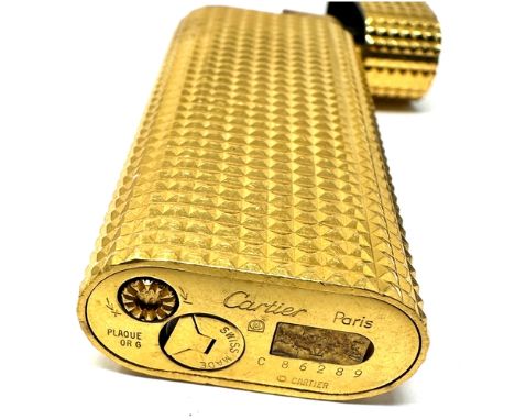 Authentic Cartier Gold plated lighter. Gold plated with a polished pyramid texture. 2 .3'' Tall x 1'' Wide x 1/2'' Thick 70.5