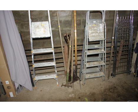 A quantity of long handled gardening tools