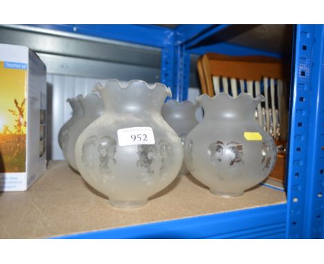 A set of six glass opaque light shades 