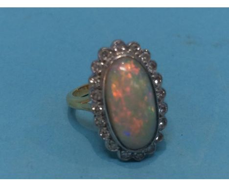 An opal set ring, stamped '18ct' size 'G', 4.6grams