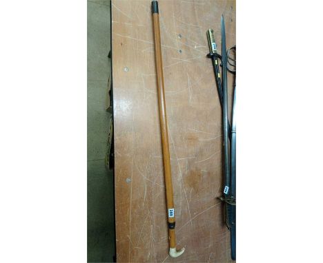 A sword stick with bamboo scabbard