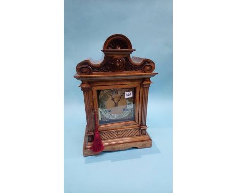 A walnut cased mantle clock