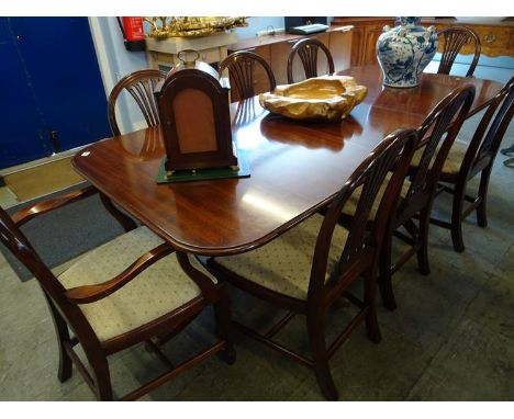 A mahogany double pillar reproduction dining table and eight chairs (6+2), 212x98cm, including leaf 