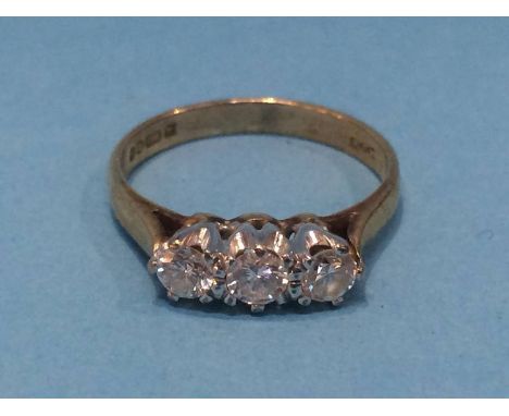 A 9ct three stone diamond ring, size 'K', 2 grams