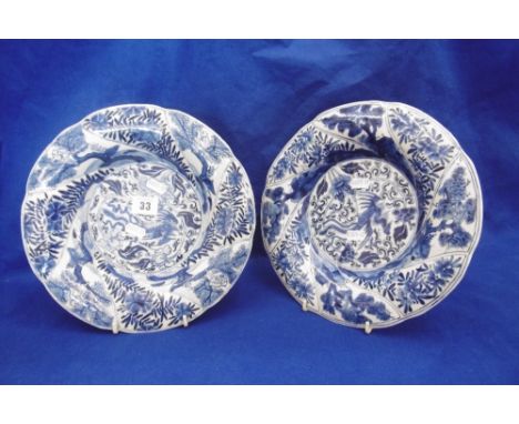 A PAIR OF ANTIQUE ORIENTAL BLUE AND WHITE PLATES (POSSIBLE 18TH CENTURY CHINESE) RETAIL,LABEL FOR BLUETT AND SONS ON BASE