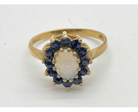 A 9ct Gold Stone Set Dress Ring, of floral cluster design, to dainty tapered band (2.6grams).The ring is a size M/N.