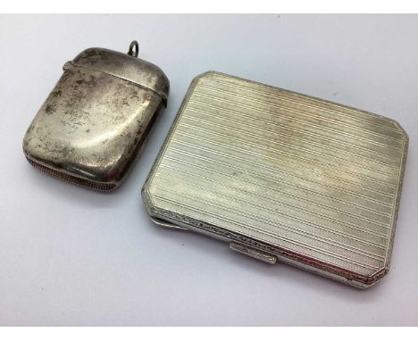 A Small Hallmarked Silver Cigarette Case, allover engine turned decoration (7.7cm); together with a hallmarked silver vesta c