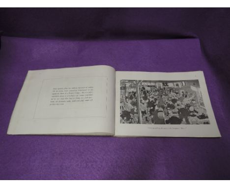 A volume, Handle with Care by R Anderson and D Westmacott a series of war time cartoons by prisoners of war during WW2