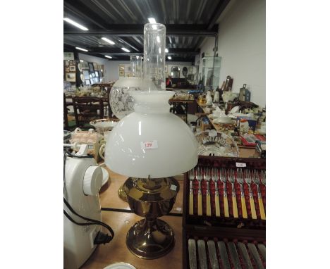 A brass bodied oil burning lamp