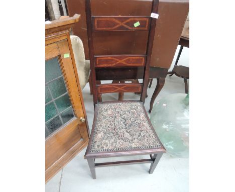 An Edwardian mahogany chair having high ladder back with inlay decoration with tapestry seat and short tapered legs