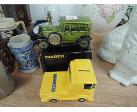 A Wabco boxed truck money box and a F-1925 model car thermometer