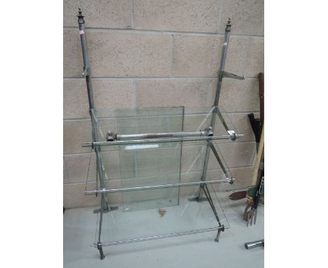 A glass shelved display shelf and similar rack