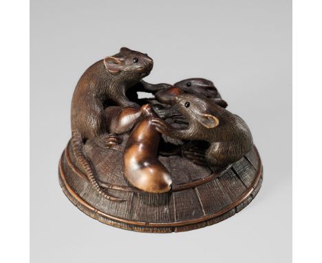 KEIGETSU: A WOOD NETSUKE OF RATS ON A STRAW HATBy Keigetsu, signed Keigetsu 桂月Japan, second half of the 19th centuryFinely ca
