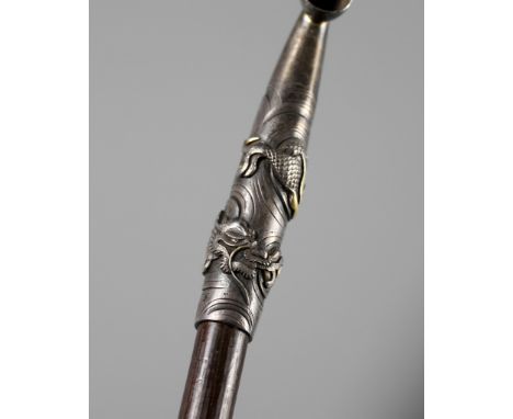 A FINE AND LARGE SILVER AND BAMBOO KISERU (PIPE) DEPICTING TWIN DRAGONSUnsignedJapan, late 19th centuryThe silver fittings de