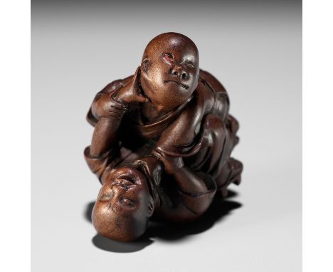 MIWA: A FINE WOOD NETSUKE OF TWO BLIND MEN FIGHTINGBy Miwa, signed with a kakihanJapan, Edo (Tokyo), early 19th century, Edo 