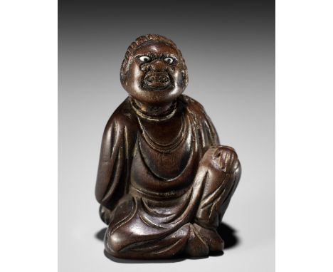 A FINE NETSUKE OF A SEATED IMMORTAL, ATTRIBUTED TO MIWAAttributed to Miwa, unsignedJapan, Edo (Tokyo), early 19th century, Ed