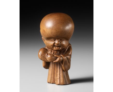 KOKEISAI SANSHO: A SUPERB WOOD NETSUKE OF FUKUSUKE WITH AN OKAME MASKBy Kokeisai Sansho (1871-1936), signed Sansho and kakiha