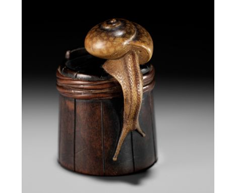 SHIGEMASA: A SUPERB WOOD NETSUKE OF A SNAIL ON BUCKETBy Shigemasa, signed Shigemasa 重正Japan, Nagoya, mid-19th century, Edo pe