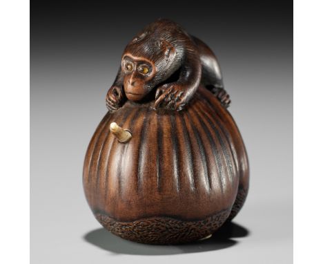 MASAHIRO: A FINE INLAID WOOD NETSUKE OF A MONKEY ON A PAIR OF CHESTNUTS By Masahiro, signed Masahiro 正廣Japan, Osaka, mid-19th