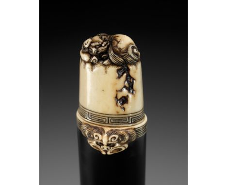 A FINE EBONY AND ANTLER KISERUZUTSU WITH SHISHI, ATTRIBUTED TO RENSAIAttributed to Rensai, unsignedJapan, Tokyo, Asakusa Dist