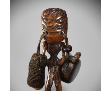 OZAKI KOKUSAI: A SUPERB ANTLER OBI-HASAMI NETSUKE DEPICTING A SHISHI-HEADED MONSTERBy Ozaki Kokusai (1835-1892), signed with 