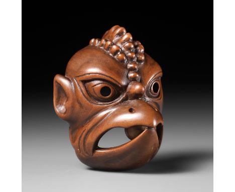 ITTOKUSAI: A SUPERB AND LARGE WOOD GIGAKU MASK NETSUKE OF KARURA (GARUDA)By Ittokusai, signed Ittokusai 一得齋Japan, Edo (Tokyo)