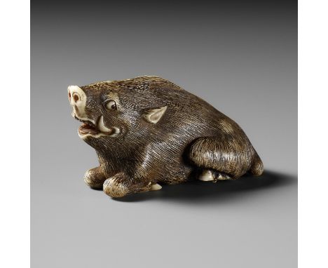A KYOTO SCHOOL IVORY NETSUKE OF A FRIGHTENED RECLINING BOARUnsignedJapan, Kyoto, late 18th-early 19th century, Edo period (16