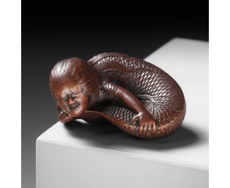 TADATOSHI: A SUPERB NAGOYA SCHOOL WOOD NETSUKE OF A NINGYO (MERMAID)    By Tadatoshi, signed Tadatoshi 忠利Japan, Nagoya, early