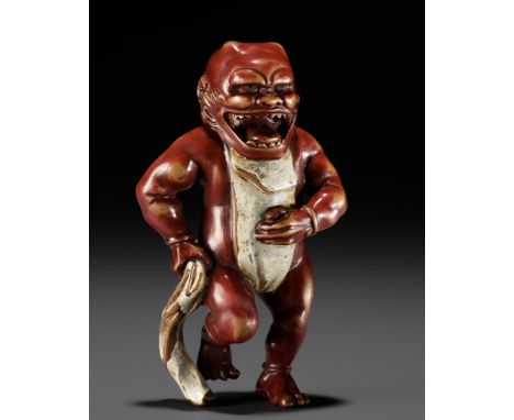 A RARE LACQUERED WOOD NETSUKE OF AN ONI TYING HIS FUNDOSHIUnsignedJapan, 19th century, Edo period (1615-1868)An amusing and u