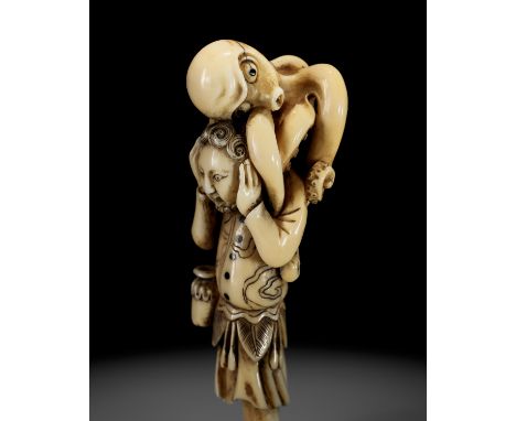 A RARE IVORY NETSUKE OF A DUTCHMAN WITH AN OCTOPUSUnsignedJapan, 19th centuryAmusingly carved as a panicked Dutchman standing