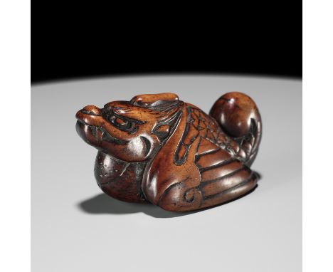 A RARE WOOD NETSUKE OF A HIRYU (FLYING DRAGON), SOKEN KISHO TYPEUnsignedJapan, 18th century, Edo period (1615-1868)Boldly car