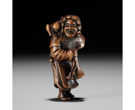 A GOOD WOOD NETSUKE OF A DUTCHMAN WITH CHILDUnsignedJapan, 18th century, Edo period (1615-1868)Typically depicted with should