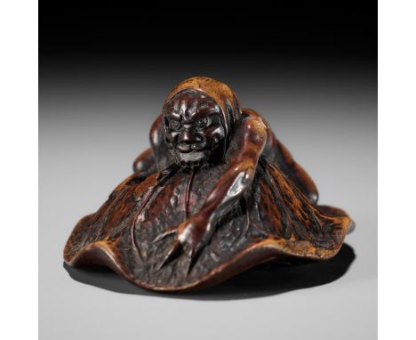 HOSHUNSAI MASAYUKI: A FINE WOOD NETSUKE OF AN ONI CATCHING A TERRAPINBy Hoshunsai Masayuki, signed Masayuki 正之 with kakihanJa
