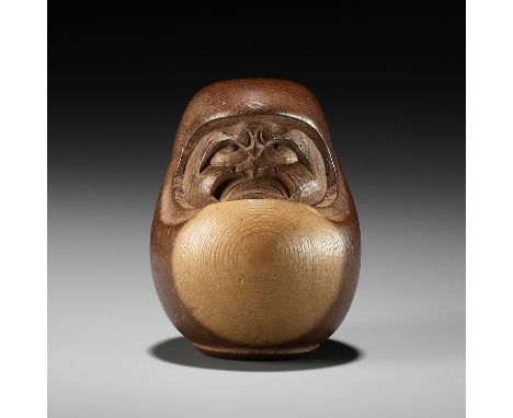 SUKEYUKI: A RARE HIDA SCHOOL ITTOBORI YEW WOOD NETSUKE OF A DARUMA DOLLBy Kawashiri Sukeyuki (died 1915), signed Sukeyuki 亮之J