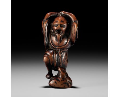 A RARE AND EARLY WOOD NETSUKE OF KOSHOHEISignedJapan, 18th century, Edo period (1615-1868)Beautifully worn and dynamically ca