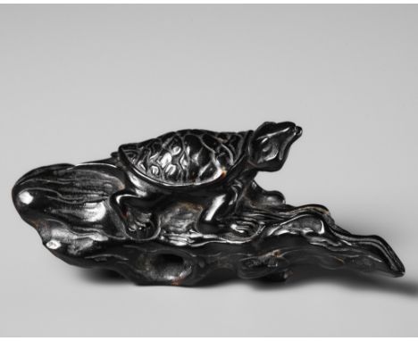 A RARE UMIMATSU NETSUKE OF A TURTLE ON DRIFTWOODUnsignedJapan, Iwami province, 18th century, Edo period (1615-1868)The turtle