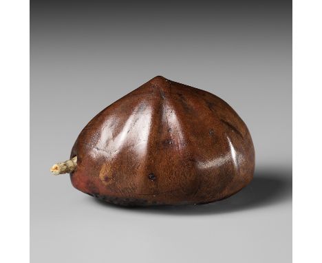 MINKO: A WOOD NETSUKE OF A CHESTNUT WITH A MOVEABLE MAGGOTBy Tanaka Juntoku Minko (1735-1816), signed Minko 岷江 and kakihanJap