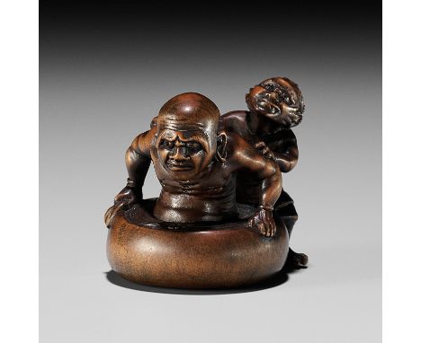 MINKOKU: A FINE AND HUMOROUS WOOD NETSUKE OF AN ONI BATHING A RAKANBy Minkoku, signed Minkoku 民谷Japan, Edo (Tokyo), mid-19th 