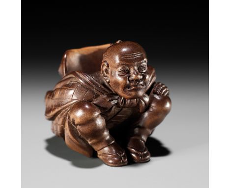 SOKYU: A FINE SO SCHOOL WOOD NETSUKE OF A MAN CARRYING A LARGE TENGU MASKBy Sokyu, signed Sokyu to 藻丘 刀Japan, Tokyo, late 19t