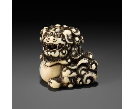 AN IVORY NETSUKE OF A SNARLING SHISHI WITH BALLUnsignedJapan, late 18th century, Edo period (1615-1868)Of early triangular sa