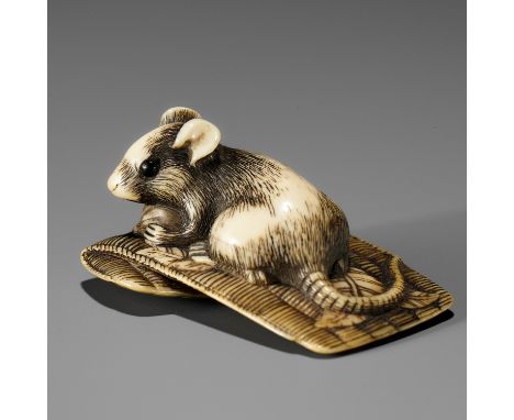 AN OSAKA SCHOOL IVORY NETSUKE OF A RAT ON A STRAW MATUnsignedJapan, Osaka, early 19th century, Edo period (1615-1868)Finely c