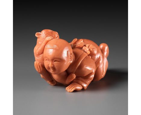 RYUHO: A VERY RARE SOLID CORAL NETSUKE OF A BOY AND CATBy Ryuho, signed Ryuho 龍峯Japan, Tokyo, late 19th century, Meiji period