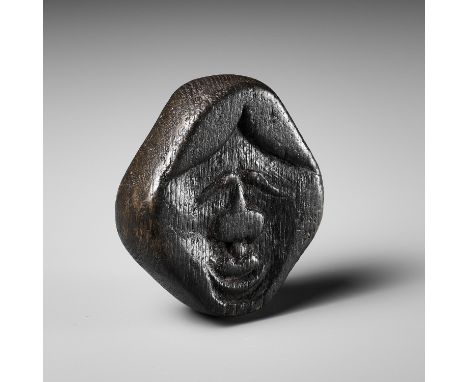 AN UNUSUAL KIRI (PAULOWNIA) WOOD SHUNGA MASK NETSUKE OF FUKUWARAI TYPEUnsignedJapan, 18th-19th century, Edo period (1615-1868