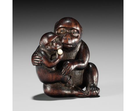 HIDECHIKA: A CHARMING INLAID WOOD NETSUKE OF A MONKEY FEEDING YOUNG By Hidechika, signed Hidechika 秀親Japan, Edo (Tokyo), mid-