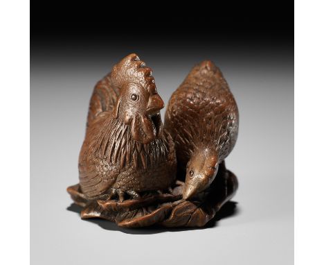 KAIGYOKUDO MASATERU: A SUPERB WOOD NETSUKE OF A COCKEREL AND A HENBy Kaigyokudo Masateru, signed Kaigyokudo 懐玉堂Japan, Osaka, 