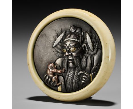 A RARE IVORY AND MIXED METAL KAGAMIBUTA DEPICTING SHOKI AND ONI, MITATE OF WASOBEIUnsignedJapan, late 19th centuryThe shibuic