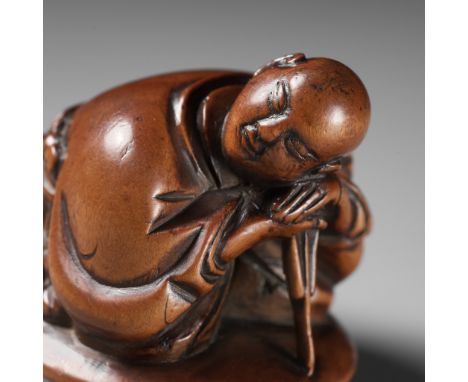 A REMARKABLE AND EARLY WOOD NETSUKE OF A SLEEPING ACTORUnsignedJapan, 18th century, Edo period (1615-1868)A large and remarka