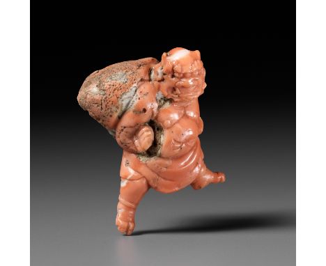 A VERY RARE SOLID CORAL NETSUKE OF FUJINUnsignedJapan, Tokyo, second half of 19th centuryAnimatedly carved as the God of Wind