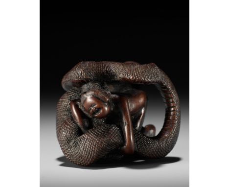 A VERY RARE SHUNGA WOOD NETSUKE OF A NAKED WOMAN AND GIANT SNAKEUnsignedJapan, probably Nagoya, 19th century, Edo period (161