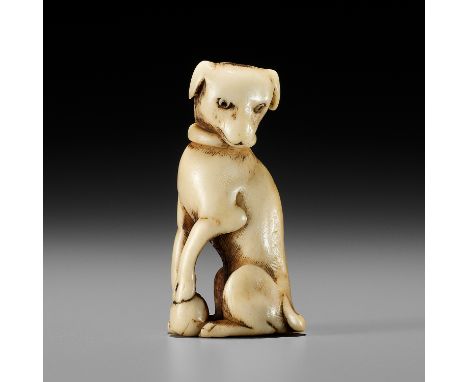 A KYOTO SCHOOL ANTLER NETSUKE OF A DOGUnsignedJapan, Kyoto, 18th century, Edo period (1615-1868)Boldly carved and beautifully